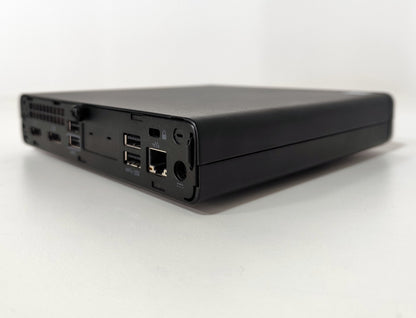 Refurbished compact mini PC with USB ports and Ethernet, on white background at Messoanuovo.it